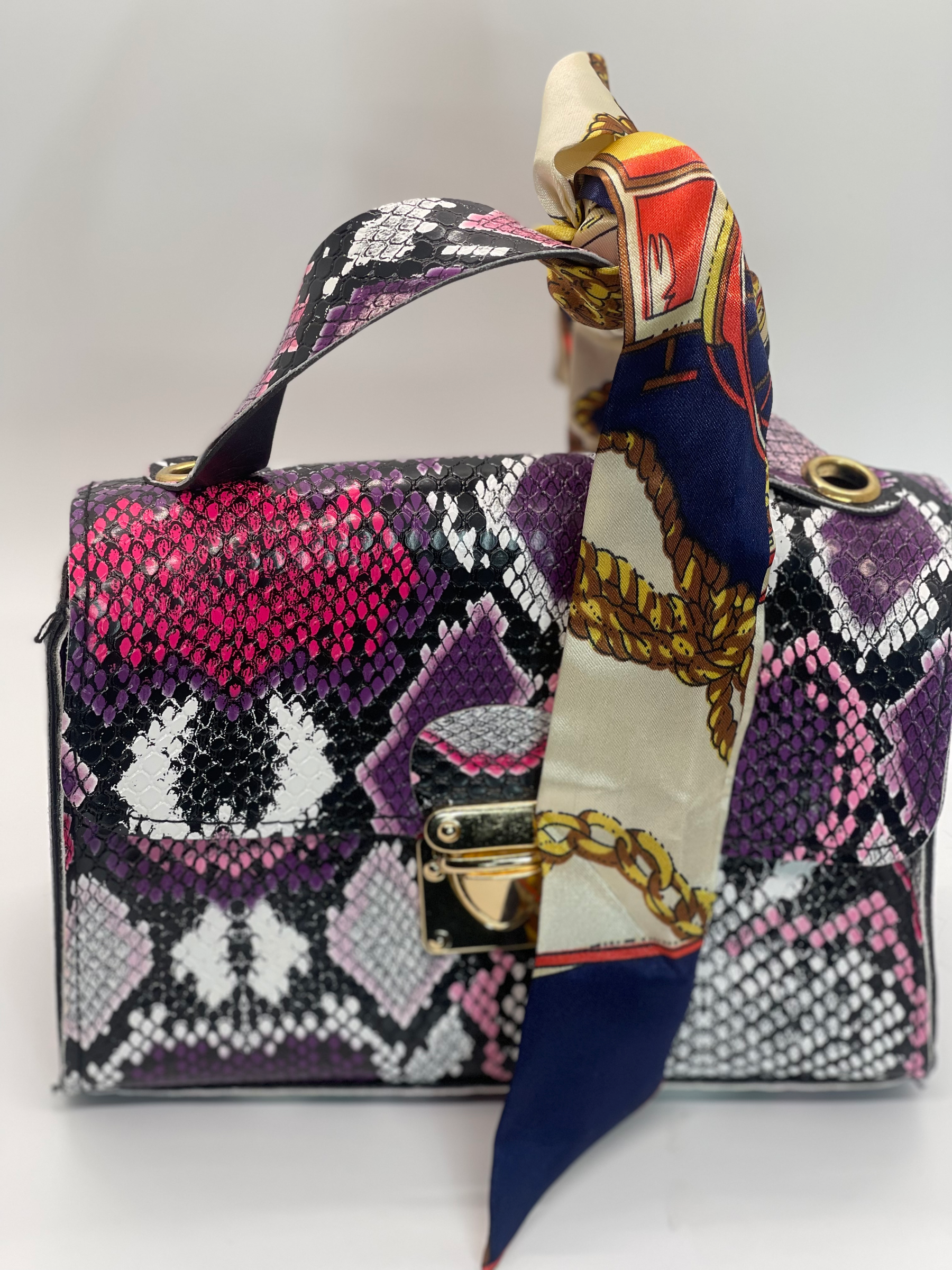 Unleash Your Inner Fashionista with the Multicolor Snake Print Handbag